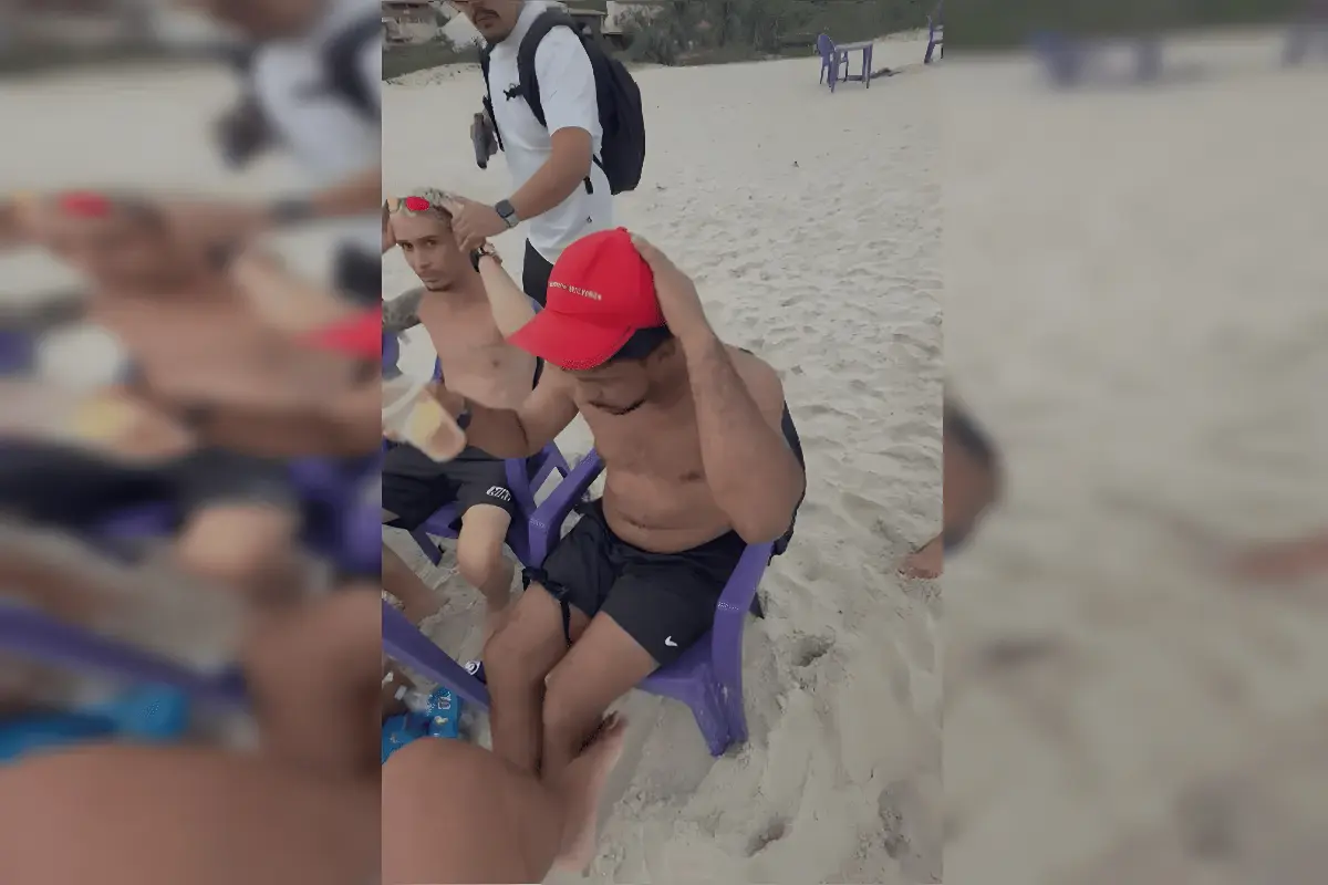 De copão na mão e bermuda, chefão do CV é preso enquanto curtia praia com amigos (Foto: Divulgação/PCERJ)